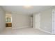 This bedroom features neutral walls, plush carpeting, and doorway access at 3005 Kenninghall Ct, Charlotte, NC 28269