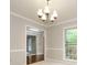Charming dining area with a chandelier, a large window, and views into other rooms at 3005 Kenninghall Ct, Charlotte, NC 28269