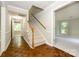 Spacious foyer with hardwood floors, staircase, and entrances to multiple rooms at 3005 Kenninghall Ct, Charlotte, NC 28269