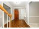 Elegant foyer with hardwood floors and staircase leading to the upper level at 3005 Kenninghall Ct, Charlotte, NC 28269