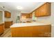 Kitchen with ample cabinet space and neutral countertops at 3005 Kenninghall Ct, Charlotte, NC 28269