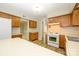 Bright kitchen with white appliances, durable countertops and floors at 3005 Kenninghall Ct, Charlotte, NC 28269
