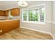 Eat-in kitchen with bay window and durable wood-look floors at 3005 Kenninghall Ct, Charlotte, NC 28269