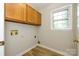 Laundry room with durable floor and window for natural light at 3005 Kenninghall Ct, Charlotte, NC 28269