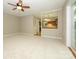 Comfortable living room with pass-through window and ceiling fan at 3005 Kenninghall Ct, Charlotte, NC 28269