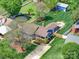 Overhead view of a home featuring a large yard, patio with fire pit, deck, and an above-ground pool at 3530 Farm Lake Sw Dr, Concord, NC 28027