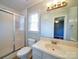 Bathroom with a stand-up shower, toilet, mirror and sink at 3530 Farm Lake Sw Dr, Concord, NC 28027