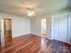 Spacious bedroom features hardwood floors, ceiling fan and access to a walk-in closet at 3530 Farm Lake Sw Dr, Concord, NC 28027