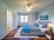 Cozy bedroom with updated ceiling fan, hardwood floors, natural light and stylish decor at 3530 Farm Lake Sw Dr, Concord, NC 28027