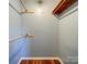 Walk-in closet with shelving provides ample storage space at 3530 Farm Lake Sw Dr, Concord, NC 28027