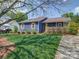 Charming home with blue siding, brown shutters, a well-manicured lawn, and a welcoming front porch at 3530 Farm Lake Sw Dr, Concord, NC 28027