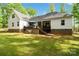 Well-maintained backyard featuring the home's stylish exterior and ample green space at 358 Grassy Ridge Ct, Clover, SC 29710