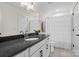 This bathroom has a gray stone countertop with white cabinets and floors and a shower at 358 Grassy Ridge Ct, Clover, SC 29710