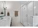 Modern bathroom featuring a walk-in shower with glass doors, white subway tiles, and updated fixtures at 358 Grassy Ridge Ct, Clover, SC 29710