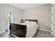 Bedroom featuring a sleigh bed, carpet floors, and a window offering natural light at 358 Grassy Ridge Ct, Clover, SC 29710