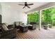 Comfortable seating area on the covered deck, perfect for relaxation and outdoor entertainment at 358 Grassy Ridge Ct, Clover, SC 29710