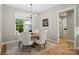 Charming dining area featuring a round table, elegant seating, and bright windows offering peaceful outdoor views at 358 Grassy Ridge Ct, Clover, SC 29710
