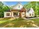 Inviting front porch with rocking chairs and wood beams, showcasing a charming entrance at 358 Grassy Ridge Ct, Clover, SC 29710