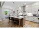 Bright, modern kitchen with a center island, sleek countertops, and stainless steel appliances at 358 Grassy Ridge Ct, Clover, SC 29710