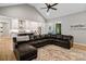 Open-concept living room with a large sectional sofa, connecting to the kitchen for seamless entertaining at 358 Grassy Ridge Ct, Clover, SC 29710