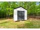 The outdoor storage shed has black doors and a white exterior at 358 Grassy Ridge Ct, Clover, SC 29710