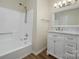 Bathroom with a shower and tub combo, vanity with marble countertop and wood floors at 3625 Colony Crossing Dr, Charlotte, NC 28226