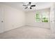 Bright bedroom features large window with natural light and neutral carpet at 3625 Colony Crossing Dr, Charlotte, NC 28226