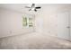 This bedroom features neutral walls, carpet, two windows, and closet at 3625 Colony Crossing Dr, Charlotte, NC 28226