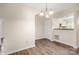 Dining area leads to kitchen through pony wall for seamless living at 3625 Colony Crossing Dr, Charlotte, NC 28226