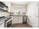 Bright kitchen features modern appliances, white cabinets, and a window over the sink at 3625 Colony Crossing Dr, Charlotte, NC 28226