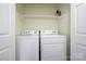 Laundry room features shelving and a side-by-side washer and dryer at 3625 Colony Crossing Dr, Charlotte, NC 28226
