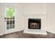 Living room has a fireplace and a French door which allow natural light to stream in at 3625 Colony Crossing Dr, Charlotte, NC 28226