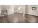 Open-concept living space includes hardwood floors, stairs, and seamless connectivity to the kitchen at 3625 Colony Crossing Dr, Charlotte, NC 28226