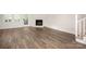 Spacious living room features hardwood floors, a fireplace, and a French door leading to the backyard at 3625 Colony Crossing Dr, Charlotte, NC 28226