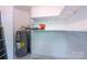 Storage room features shelves and a water heater at 3625 Colony Crossing Dr, Charlotte, NC 28226