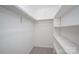Walk-in closet with carpet and built-in shelving, offering ample space for storage and organization at 3625 Colony Crossing Dr, Charlotte, NC 28226