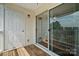 Exterior balcony with sliding glass door and wood floor at 3849 Carl Parmer Dr, Harrisburg, NC 28075