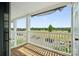 Inviting balcony with wood flooring, white railing, and outdoor view at 3849 Carl Parmer Dr, Harrisburg, NC 28075