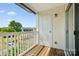 Exterior balcony with white door and white railing, outdoor view at 3849 Carl Parmer Dr, Harrisburg, NC 28075