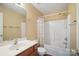 A cozy bathroom displays a single sink vanity, toilet, bathtub, shower, and towel racks at 3849 Carl Parmer Dr, Harrisburg, NC 28075