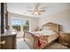 Cozy bedroom with ceiling fan, plush carpet, and sunny window at 3849 Carl Parmer Dr, Harrisburg, NC 28075