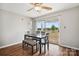 A modern dining room with hardwood floors, a black dining table and chairs, and a glass sliding door at 3849 Carl Parmer Dr, Harrisburg, NC 28075