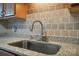 Granite countertops and stainless steel faucet featured in this well-lit kitchen at 3849 Carl Parmer Dr, Harrisburg, NC 28075