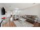 Spacious living room featuring two sofas, a mirror coffee table, and hardwood floors at 3849 Carl Parmer Dr, Harrisburg, NC 28075