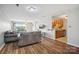 Inviting living space with wood floors, connecting to the kitchen and dining area at 3849 Carl Parmer Dr, Harrisburg, NC 28075