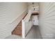 Exterior wooden staircase with white railings leading to upper-level units at 3849 Carl Parmer Dr, Harrisburg, NC 28075