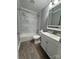 Bathroom with tile flooring, shower and tub combo, and a vanity with a white basin sink at 402 California St, York, SC 29745