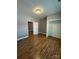 Bedroom with laminate floors and white trim, featuring a closet with a six-panel door at 402 California St, York, SC 29745