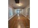Bright living room with wood-look floors, neutral wall color and natural light at 402 California St, York, SC 29745