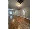 Open living area featuring wood-look floors, neutral paint, and great flow to other rooms at 402 California St, York, SC 29745
